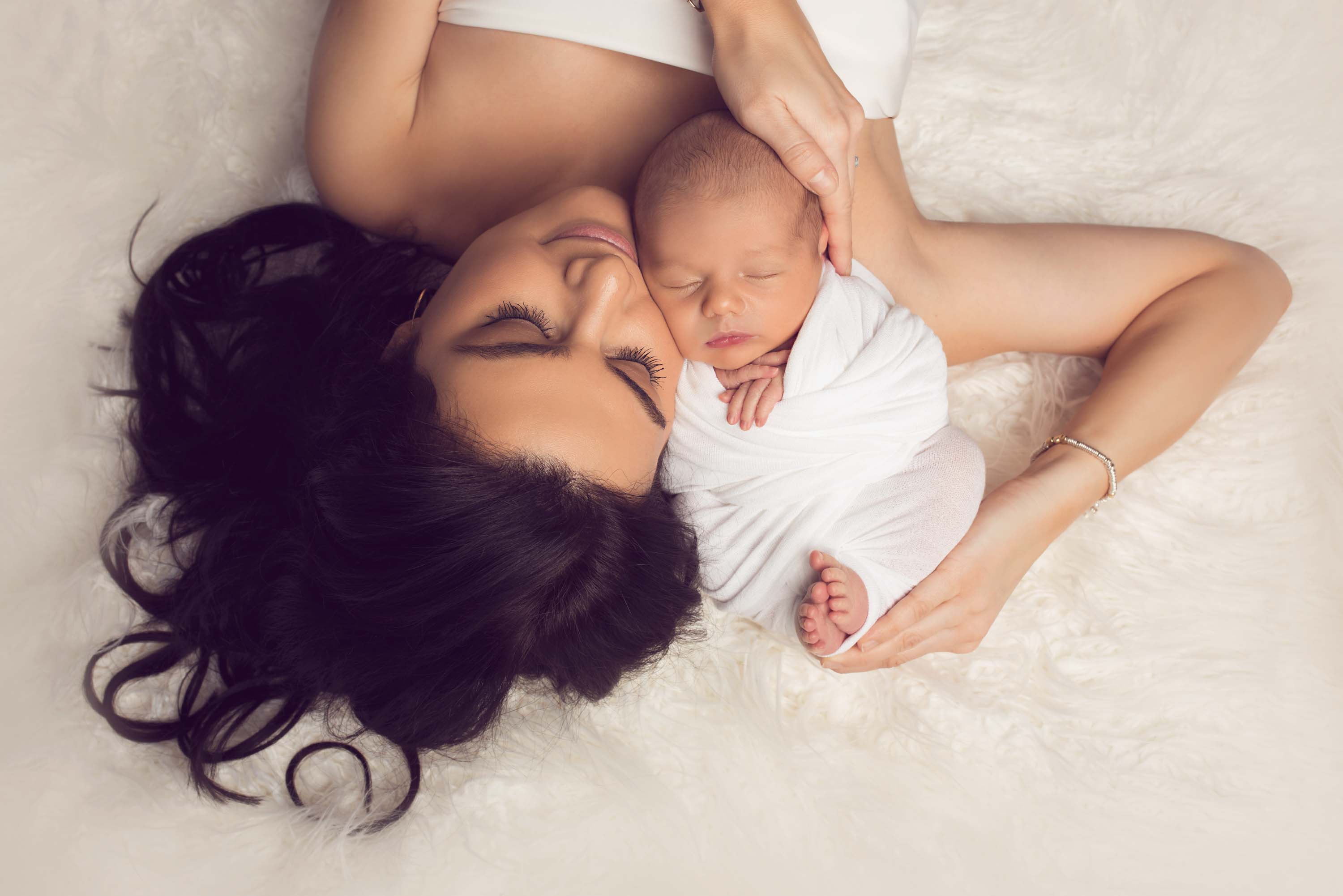 Mother and son posed for their newborn photo shoot