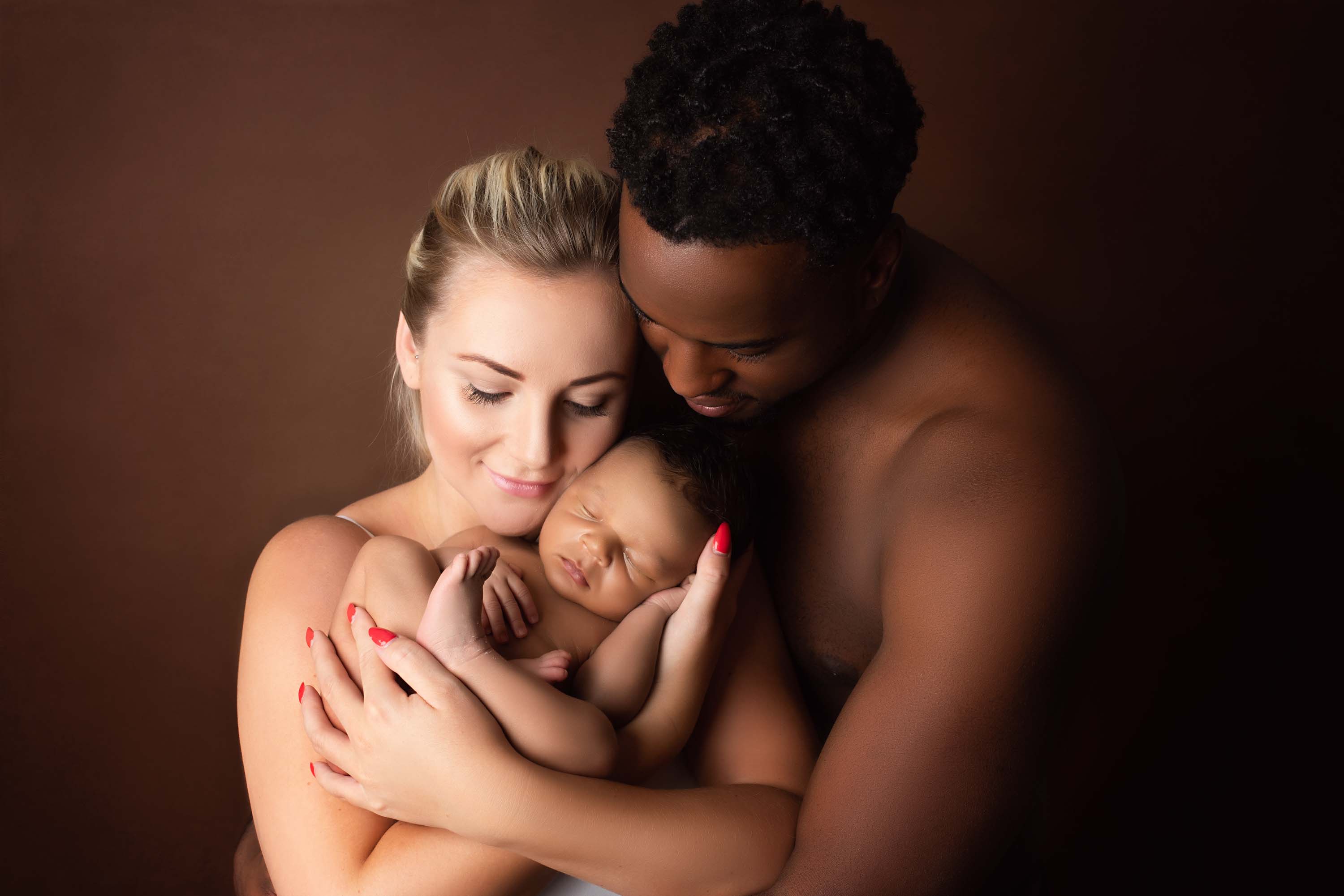New parents doing skin-to-skin with their baby boy