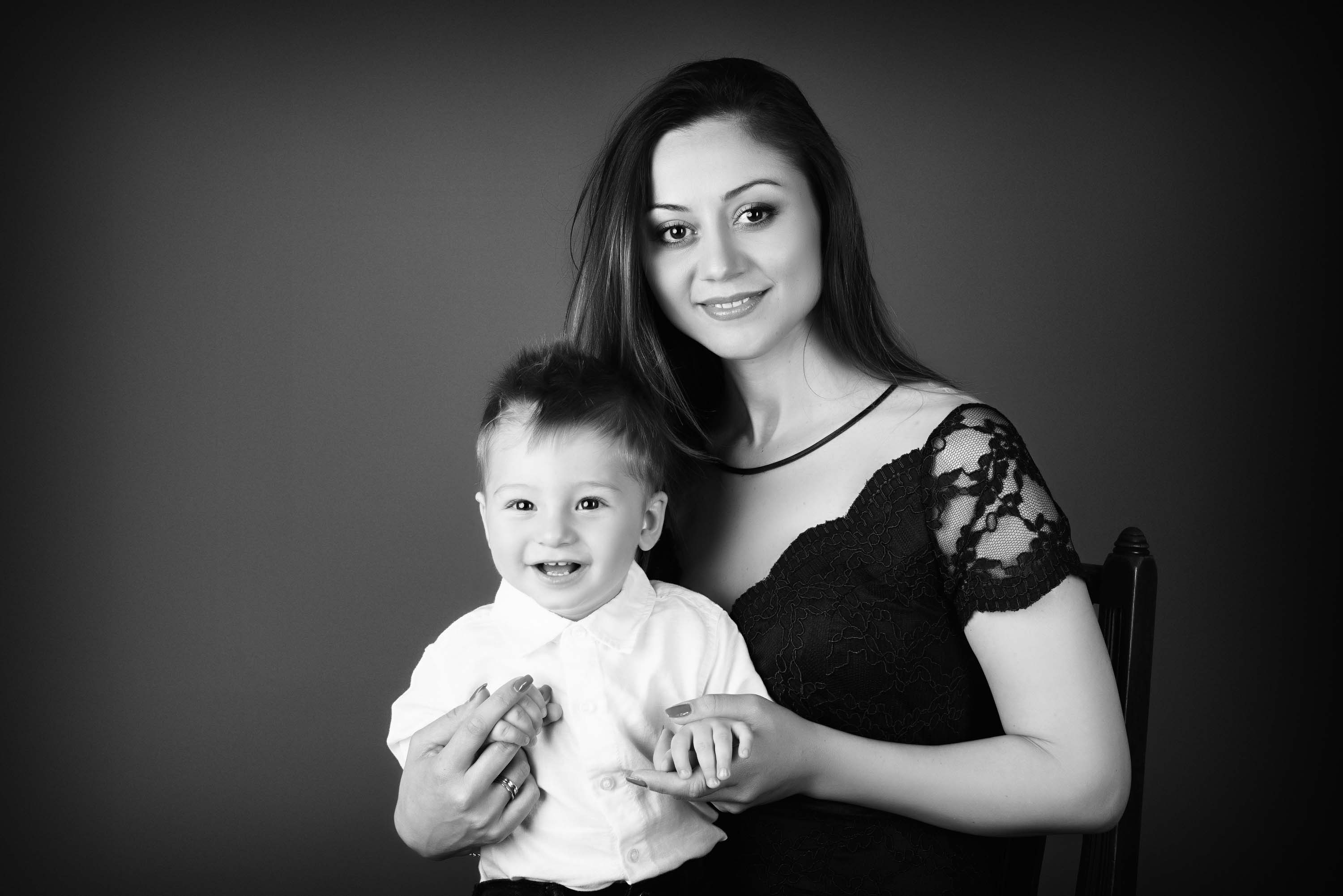 Black and white of mother and son posing on his first birthday