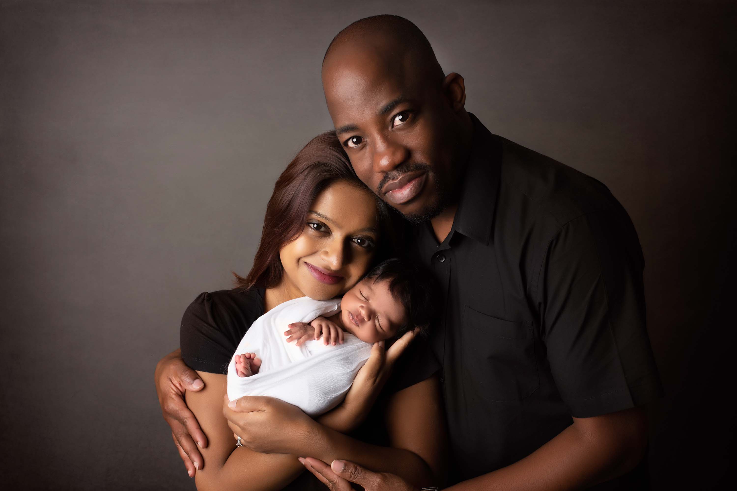Newborn photo shoot with new family of three