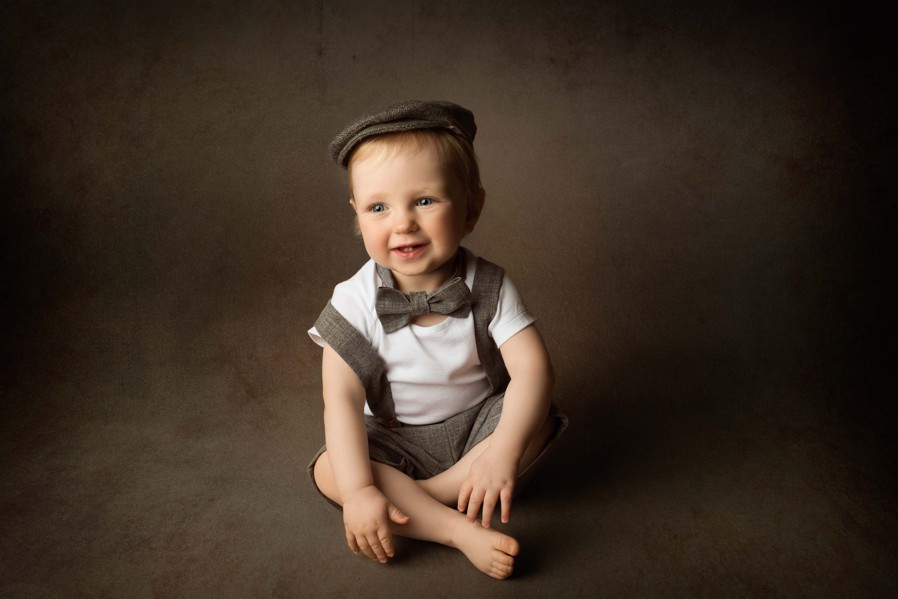 One year old posing for his first birthday portraits