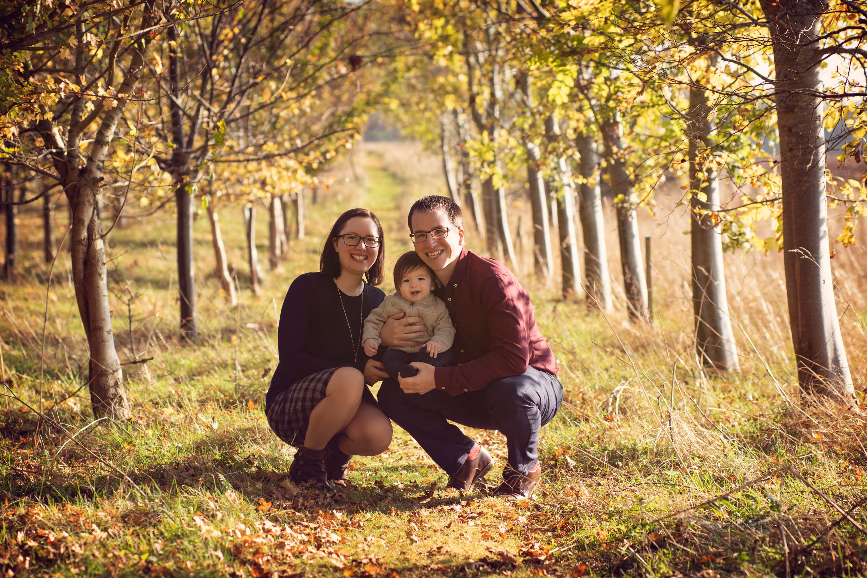 Family portrait photographed in autumn woodland