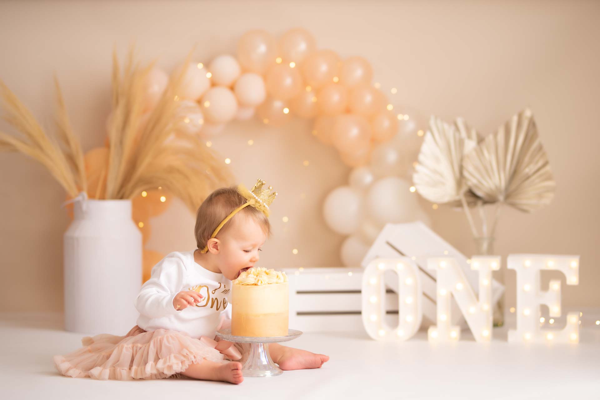 Baby girl attacking her cake face first.