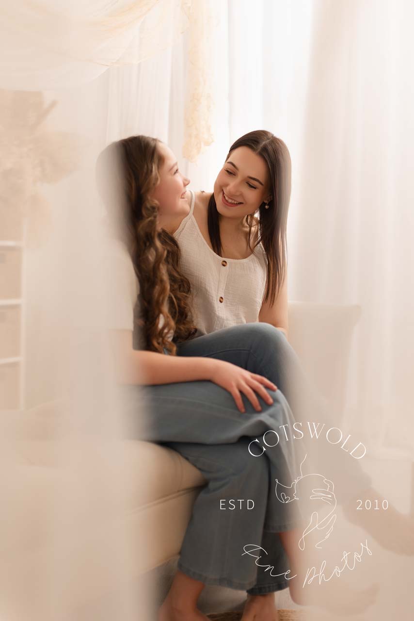 Behind the scenes photo of a mother and her daughter at their motherhood photoshoot in Chipping Norton