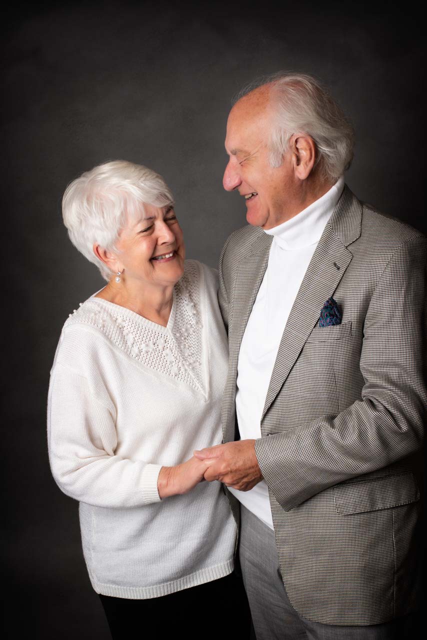 Couple holding hands celebrate a 70th birthday with a photoshoot