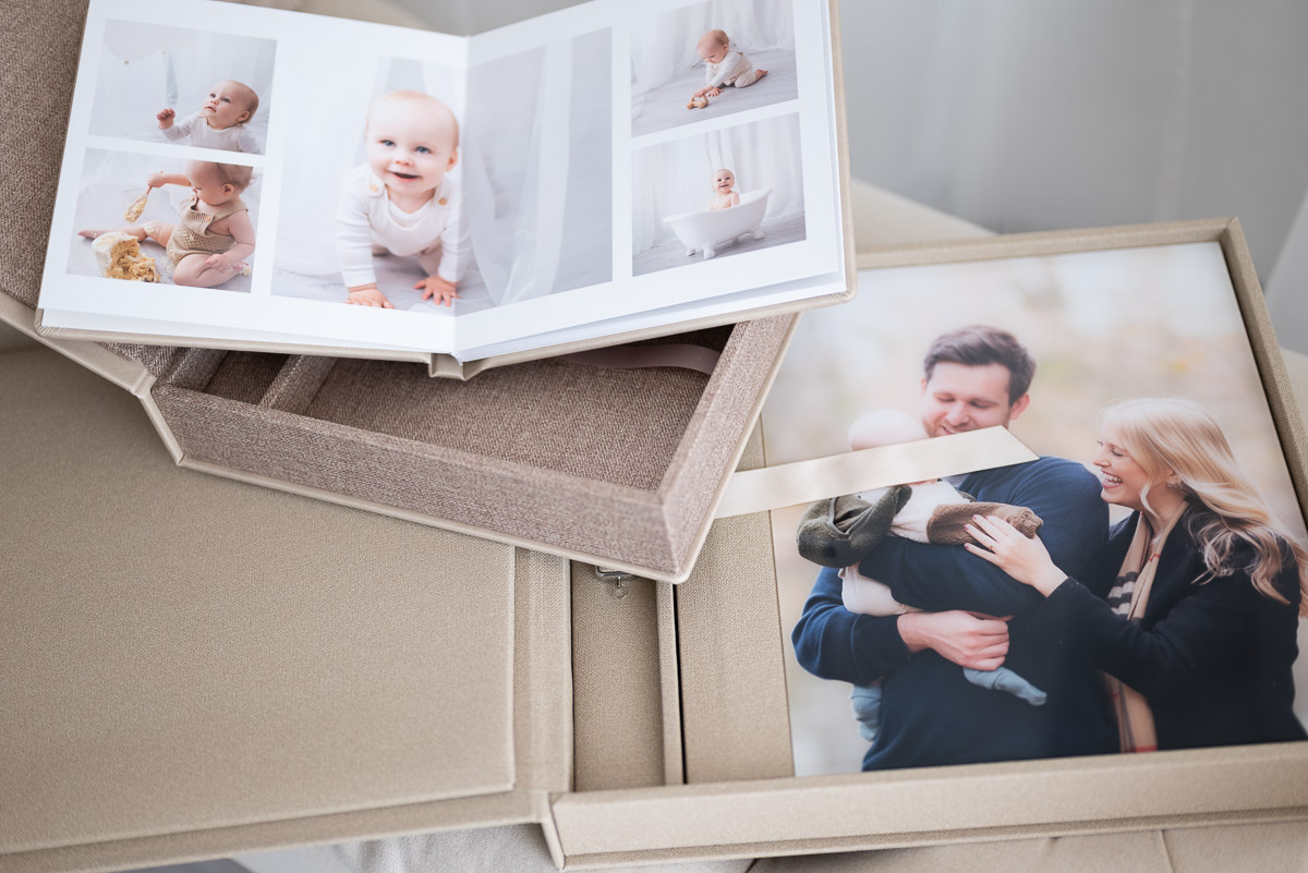 A photograph of album samples to show customers on the Oxfordshire family photography prices page of their website