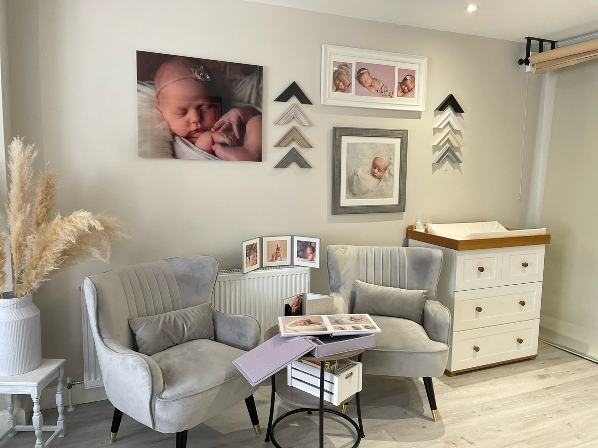 Comfy seating for customers next to a changing table in the Cotswold Fine Photos studio