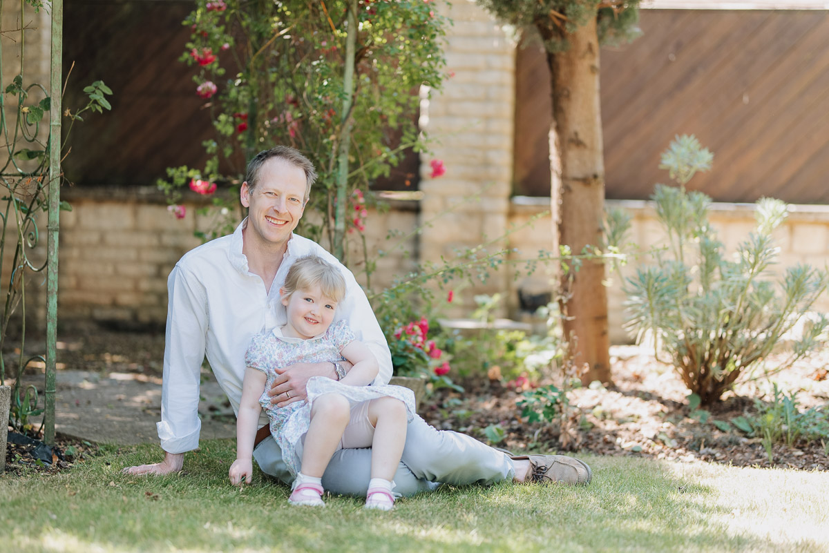 Father and daughter pose for the photographer during their photoshoot in their Oxford home